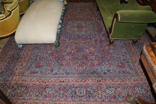 An Isphahan blue and floral medallion carpet (worn)